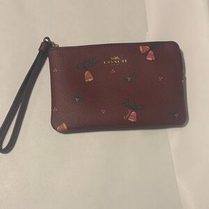 Used Christmas Print Coach Wristlet - Maroon